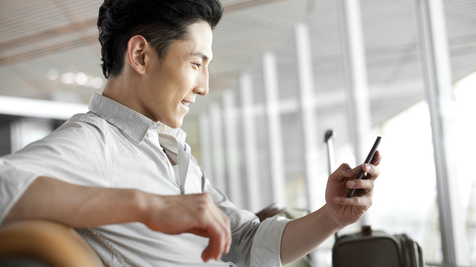 man holding a mobile phone man holding a mobile phone